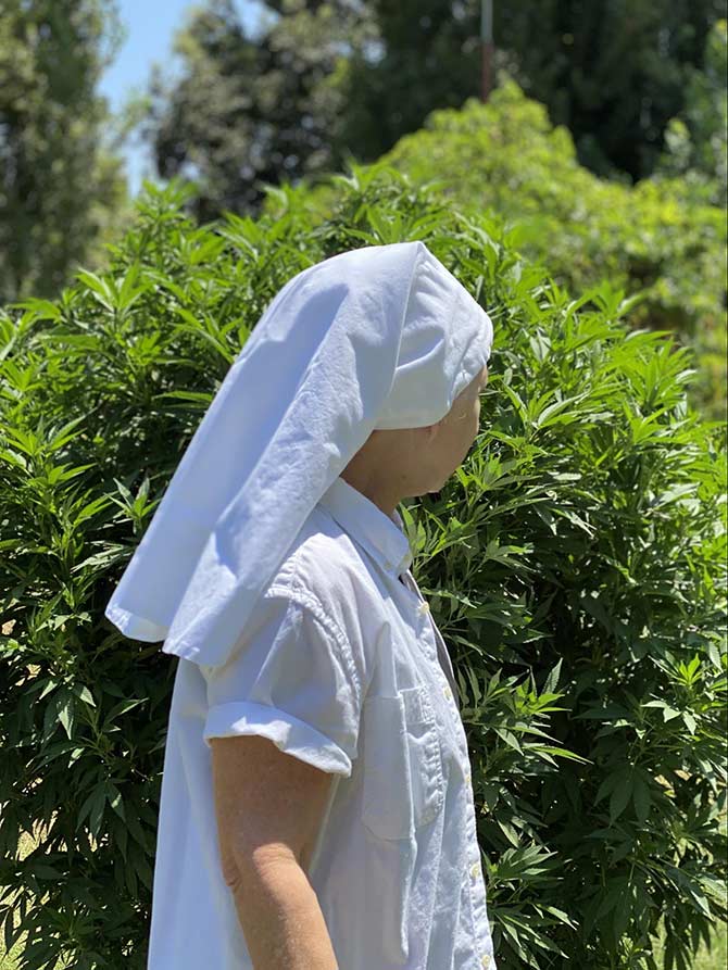 sister in front of the plant